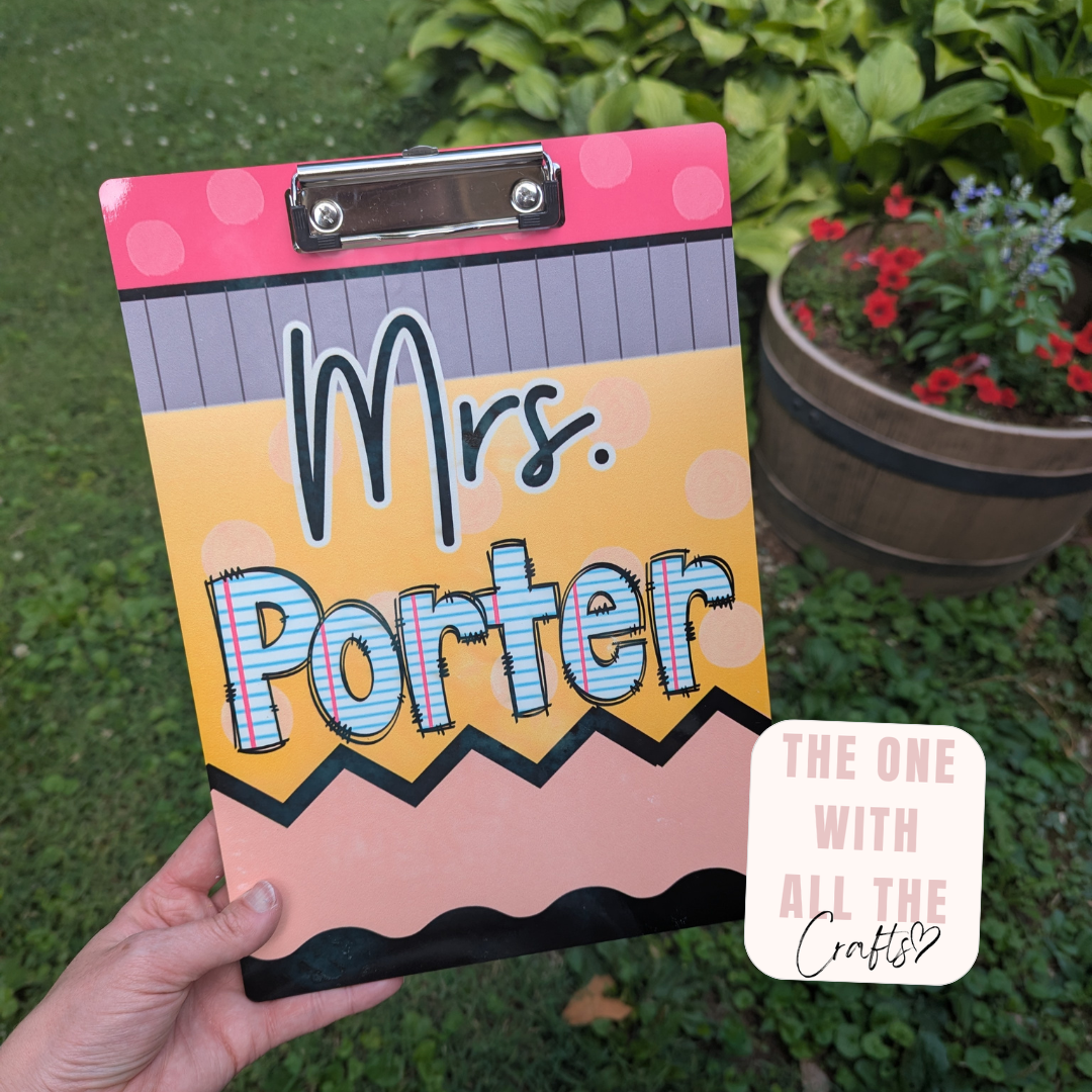 Personalized clipboard with 'Mrs. Porter' on a grassy background